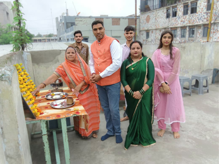 Director's family offering prayers during the Independence Day celebration